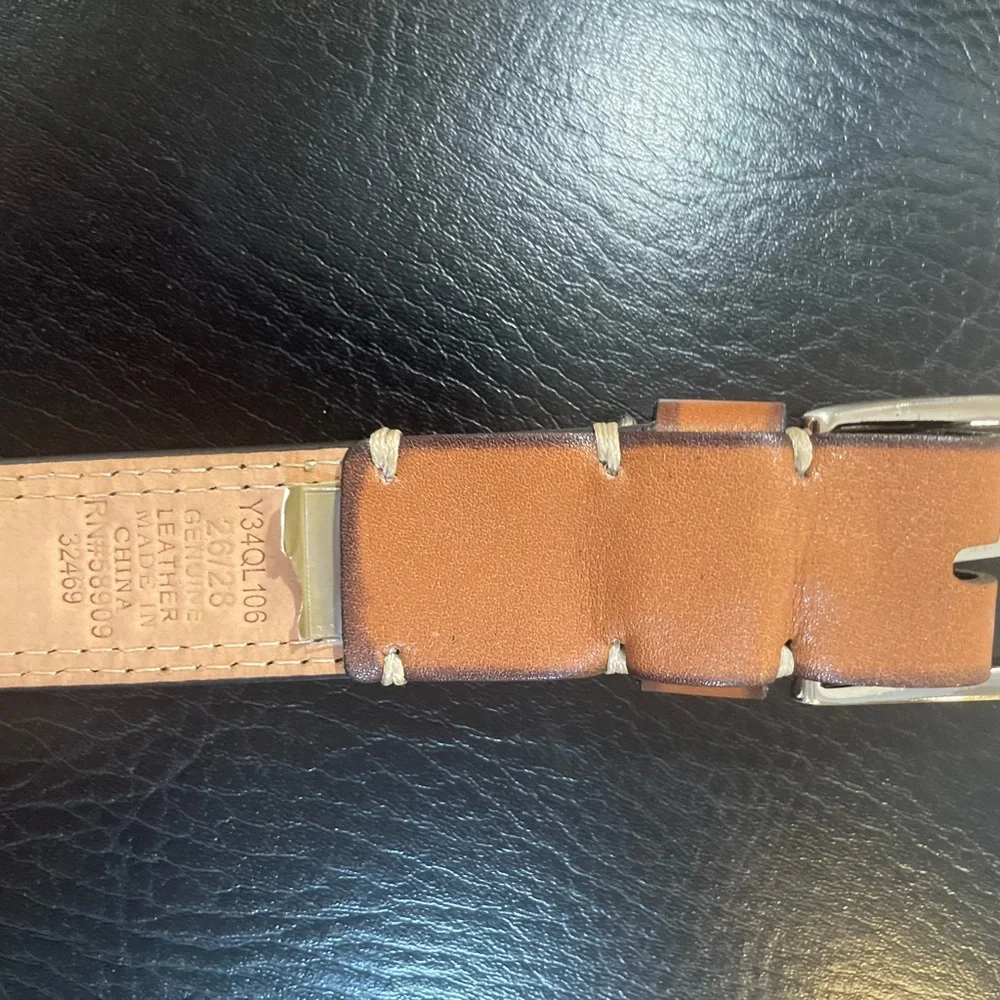 NWOT Genuine leather belt. 31” of leather end to end not including buckle.26/28